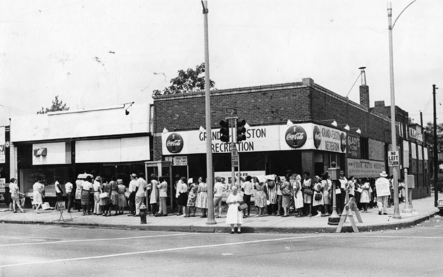 People stand in line for food stamps at St. Louis Food Stamp Office, 1325 North Grand Avenue, 1960