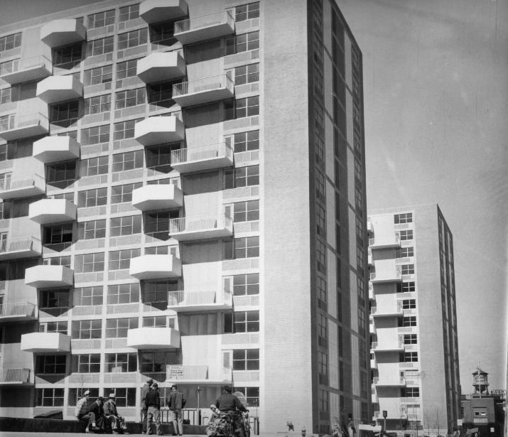 Workmen sitting idle in the 1600 block of Pine because of strike of hoisting engineers of local 513 which has halted work on Plaza Apartments, 1960