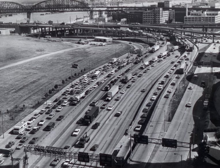 Traffic flows off the exit ramps of the Poplar Street bridge into downtown St. Louis. East Side approaches to the bridge are under repair, 1977