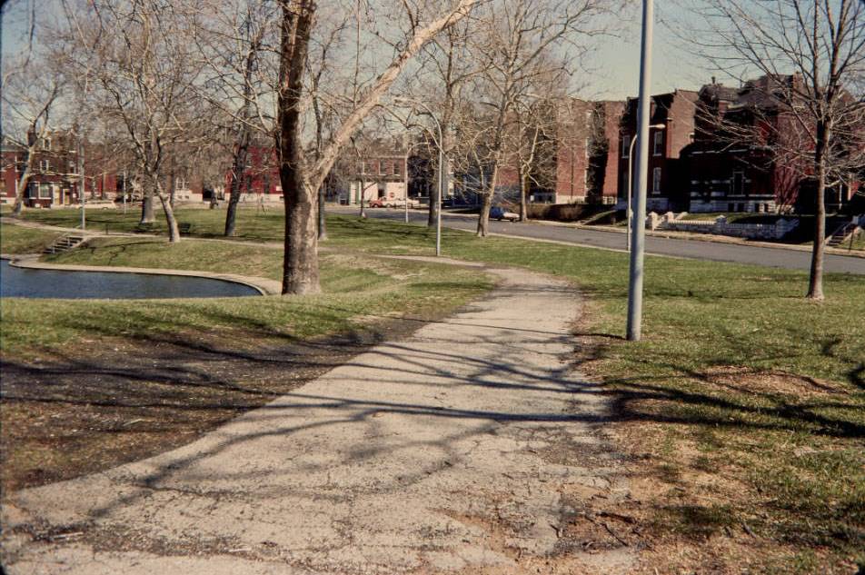 View down walk which goes around the lagoon, looking northeast, 1977