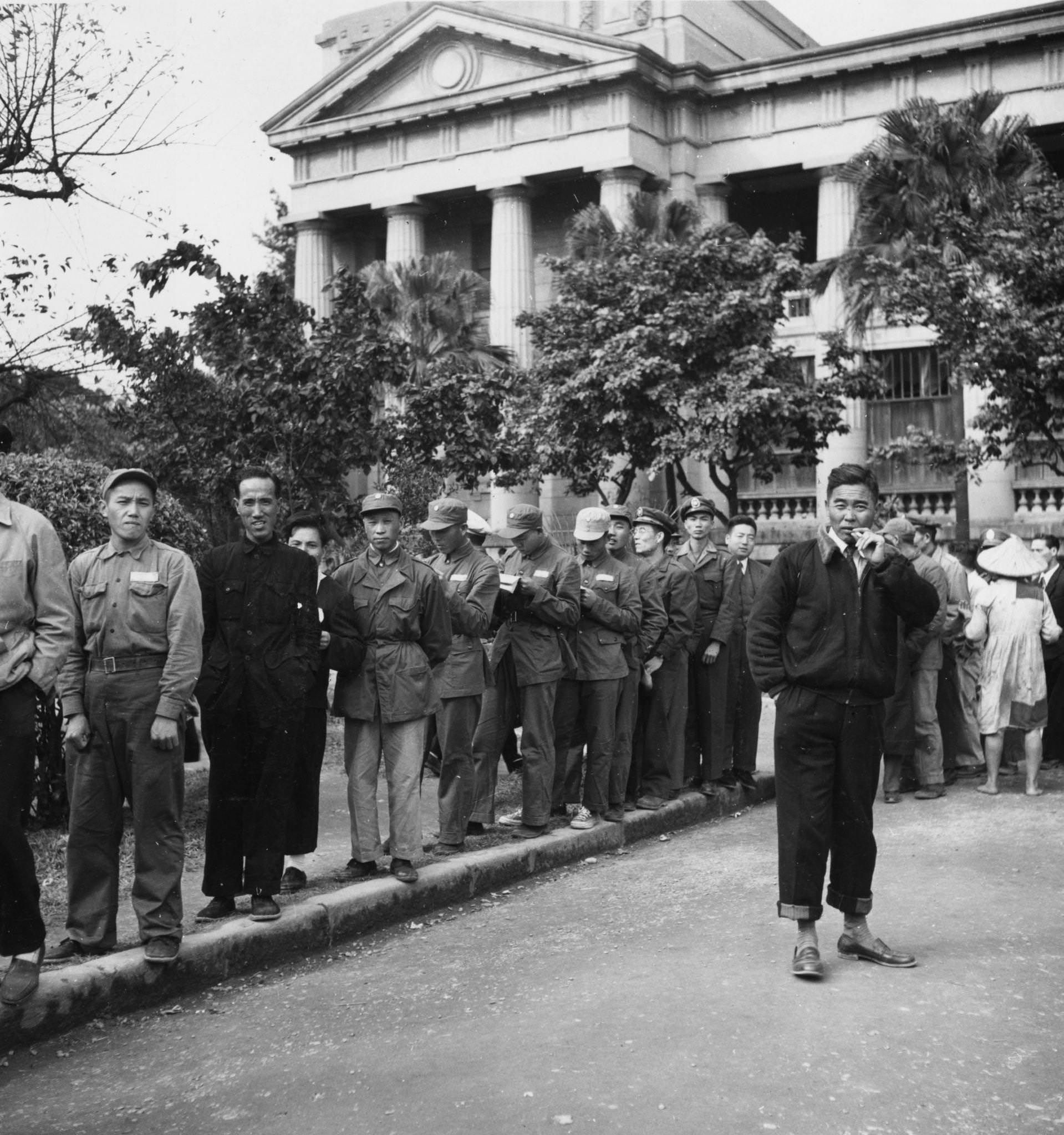Chinese Nationalist soldiers in a queue for transport home after a visit to the Taipei Museum in Taiwan, 1955