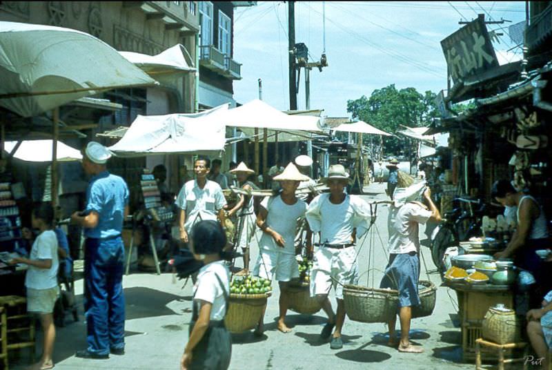 A street lined with shops and full of shoppers, Taiwan, 1954
