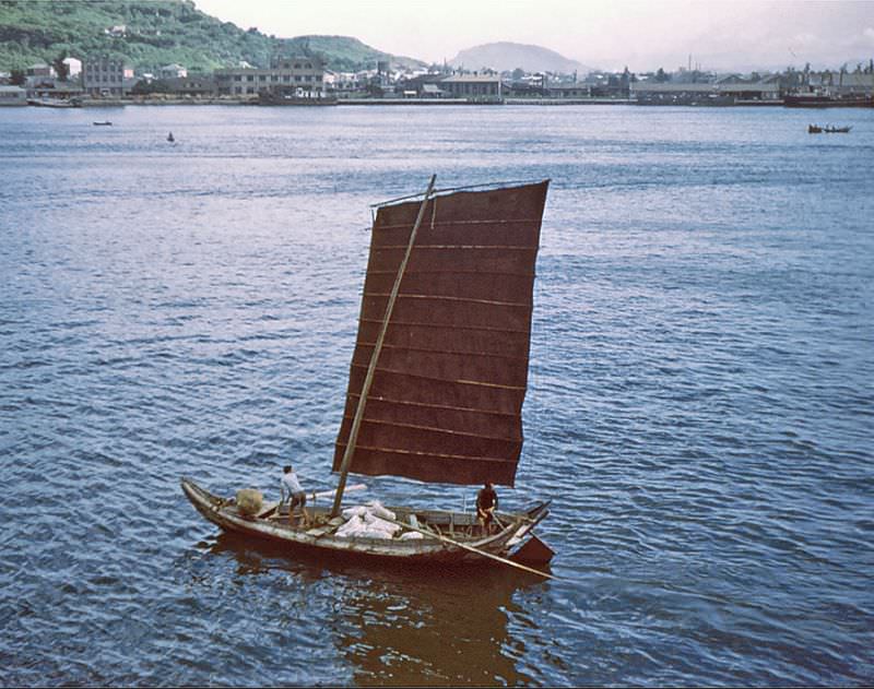 One of many fishing boats transiting the harbor, Kaohsiung, Taiwan, 1954