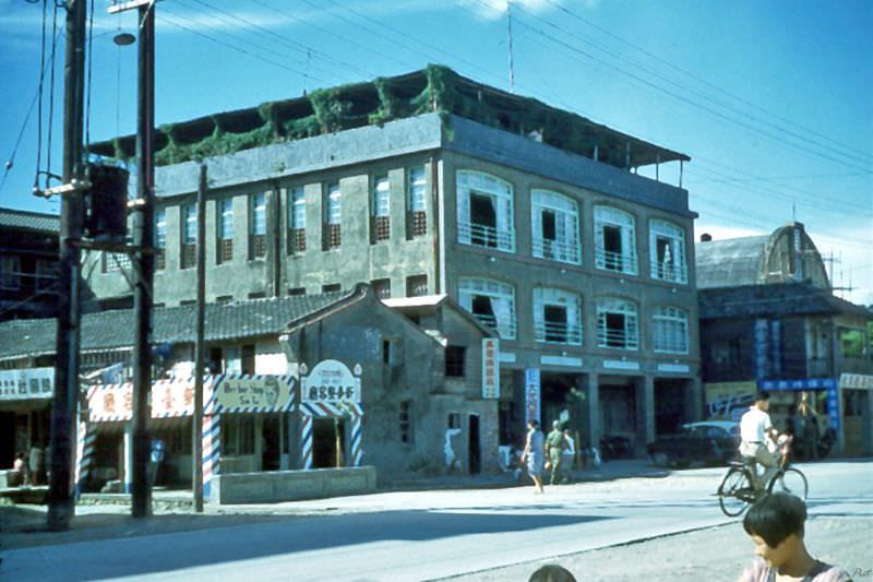 The roof top of this building hosted the Officers' Club, which was used by the US Navy and US Army MAAG troops stationed in the area, Kaohsiung, Taiwan, 1954