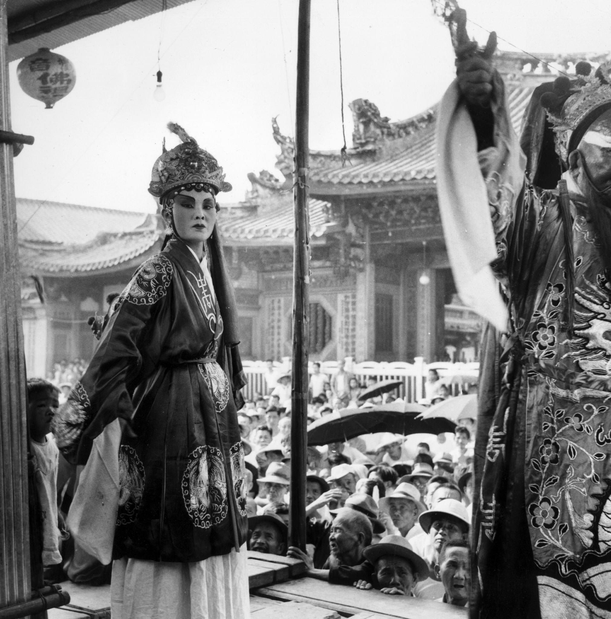 Chinese classical actors during a performance outdoors at Taipei, Taiwan, 1954