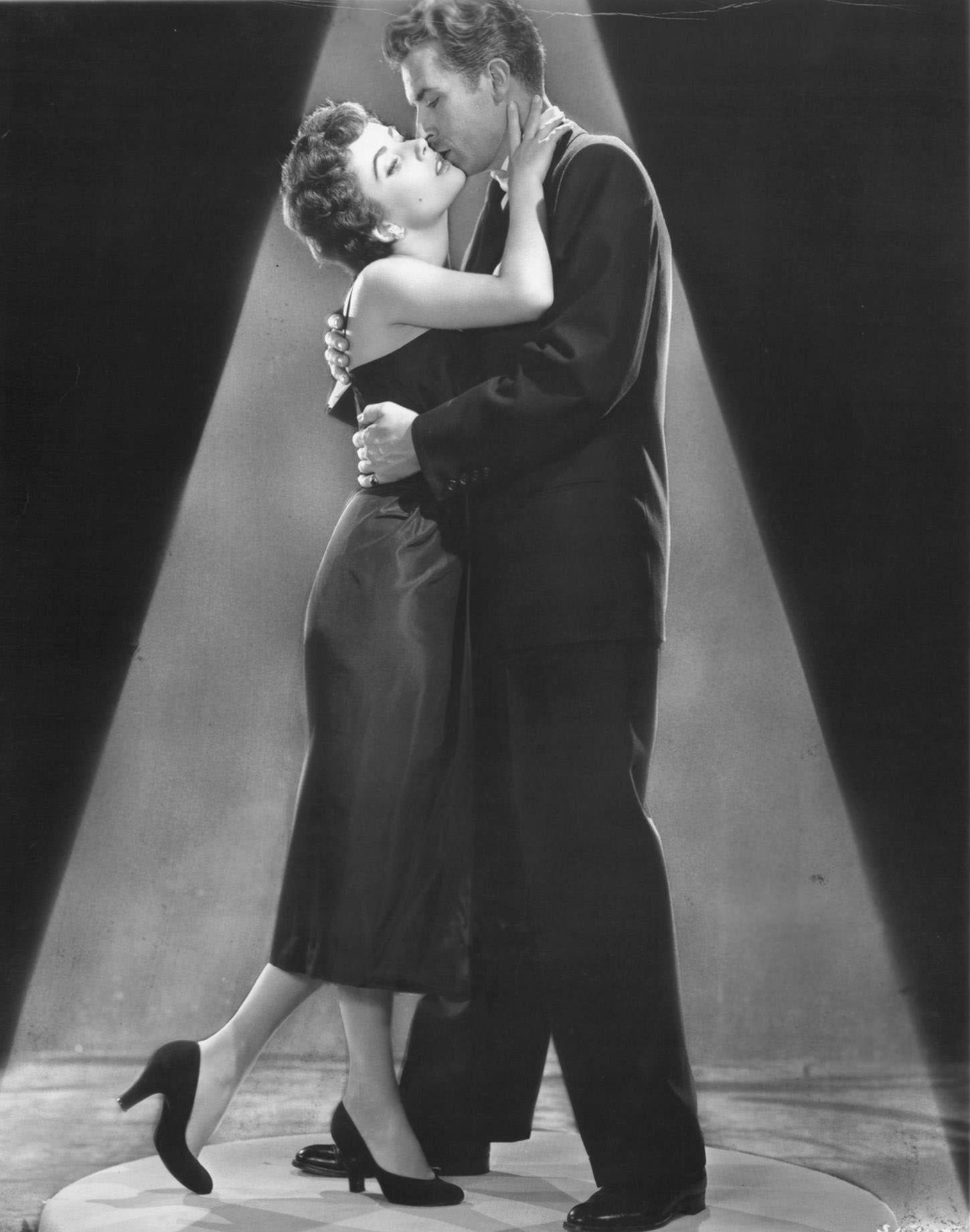 Elizabeth Taylor and Fernando Lamas embrace in a scene from 'Girl Who Had Everything' (1953).