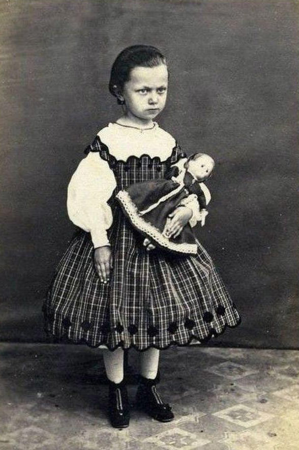 Unhappy Girl With Doll