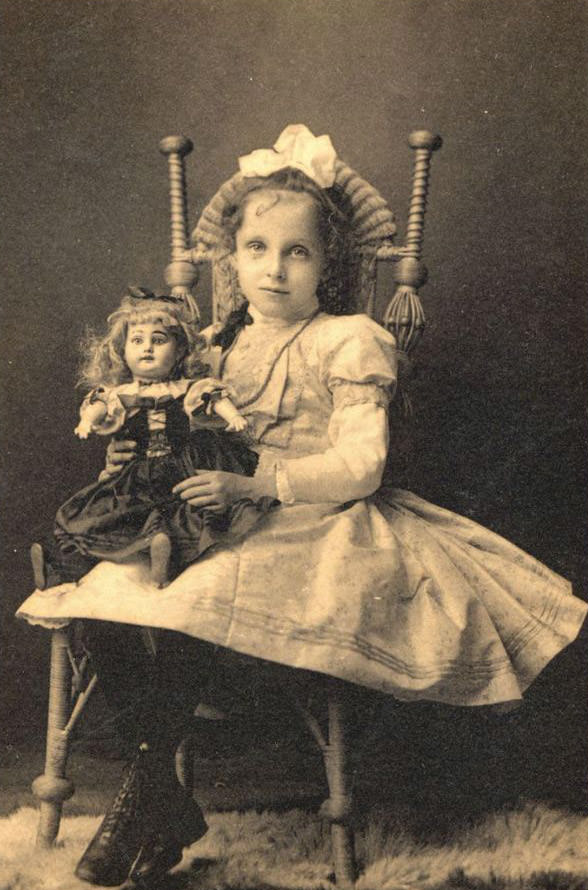 Seated Girl With Doll