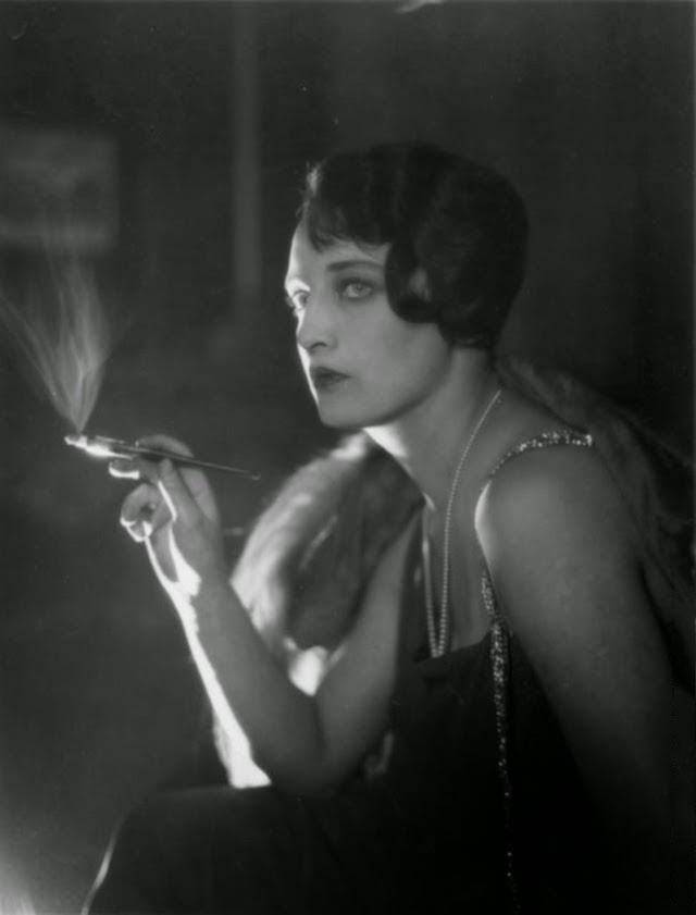 Glamorous Australian dancer Dorothy Blanchard smoking a cigarette, 1925.