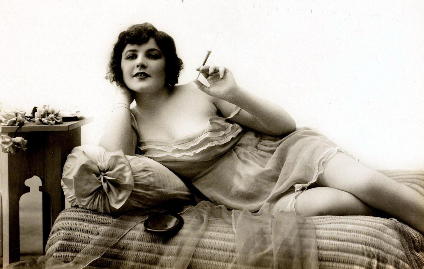 Flapper Smoking in Skimpy Night Dress, Circa 1920