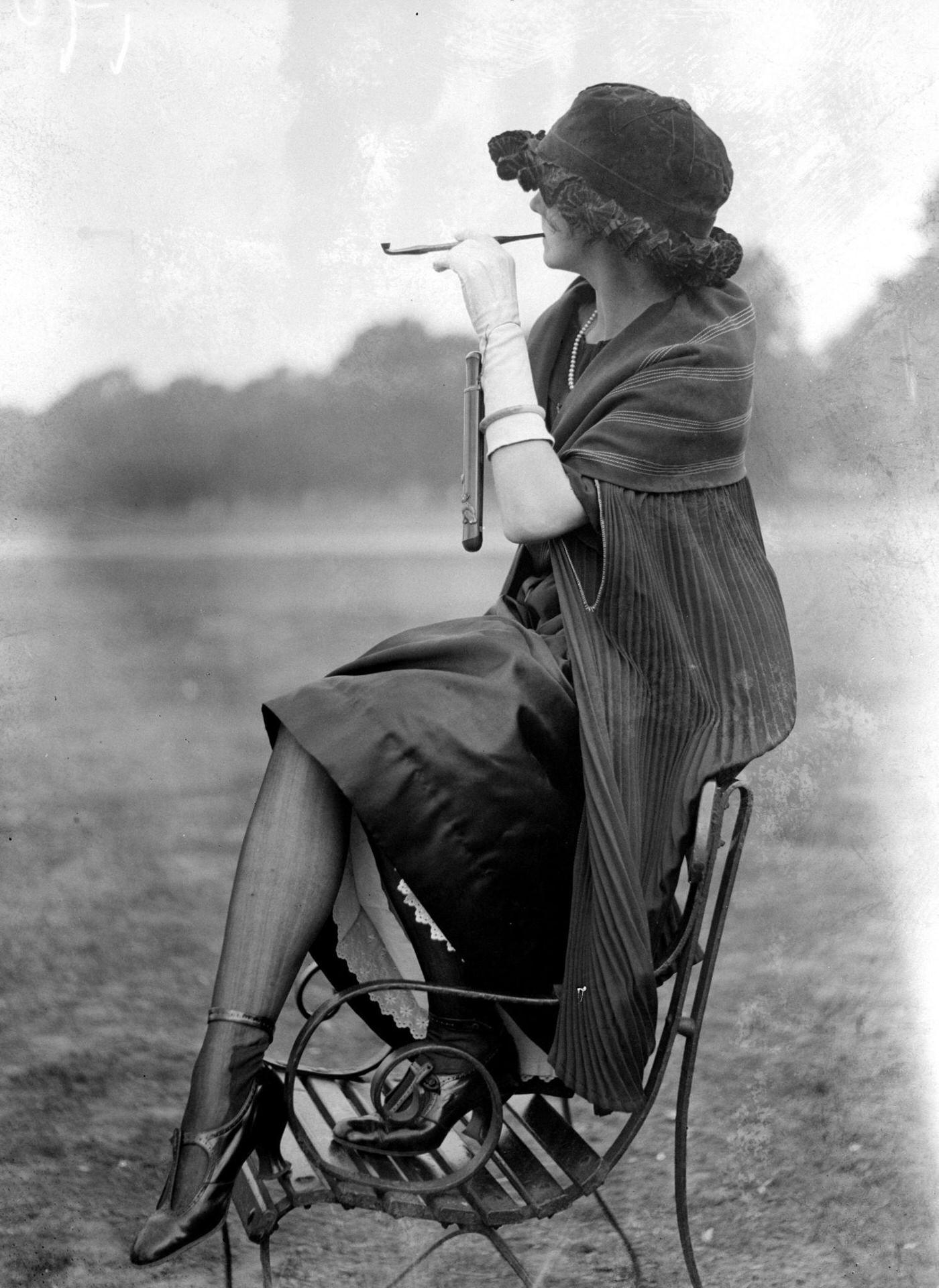 Pipe Fashions, 1924: A Woman Balancing on a Bench, Delicately Smoking