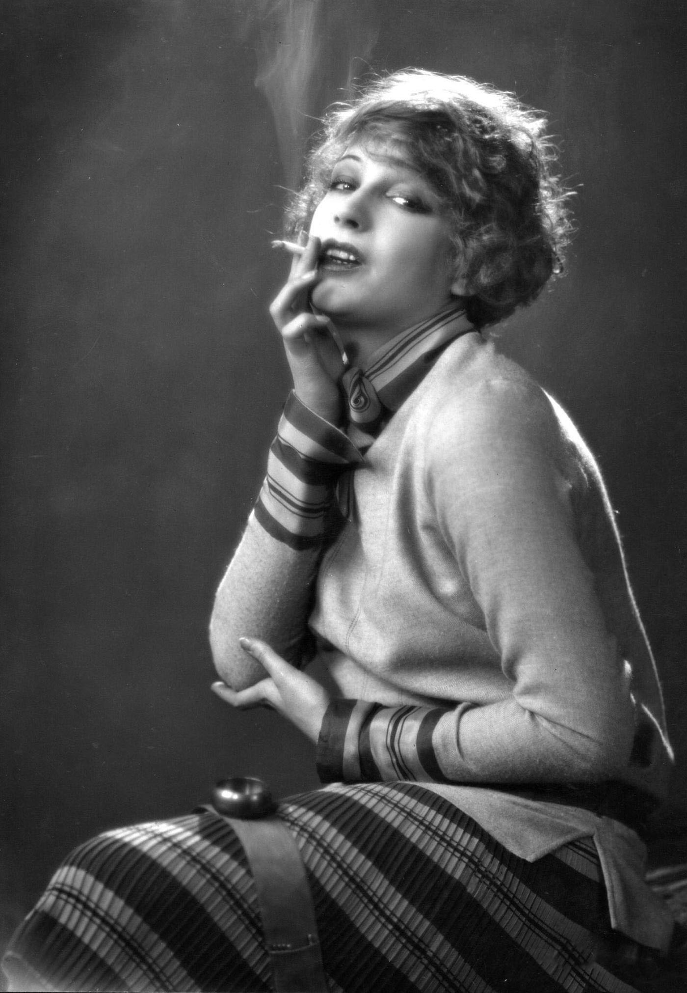 Lili Damita, French Film Actress and Errol Flynn's Wife, Radiant with a Cigarette