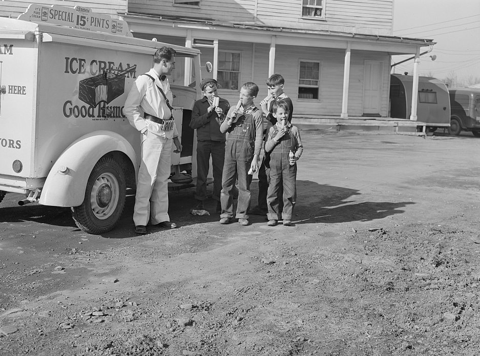 Good Humor man comes to trailer camp on Saturday afternoon. These children are sons of torpedo plant workers in Alexandria, Virginia, 1941