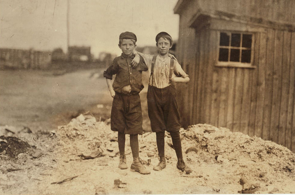 Two young carrying-in boys in Alexandria Glass Factory. Frank Clark (on left) 702 N. Patrick St., 1910