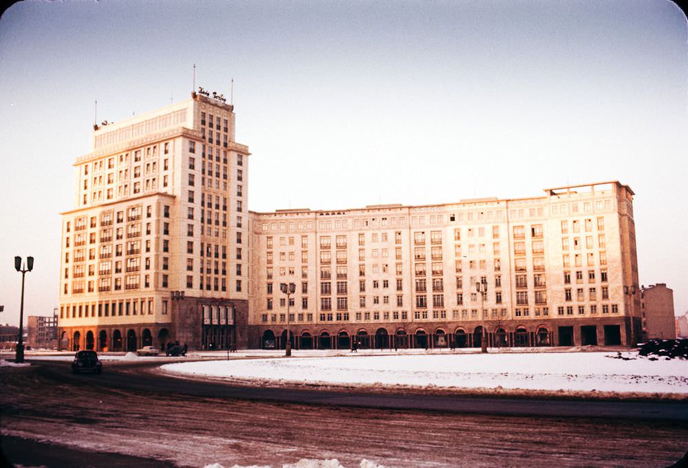 The brutalist post-war Soviet buildings and near-deserted streets make some of the photographs almost surreal. This is another view of Strausberger Platz.