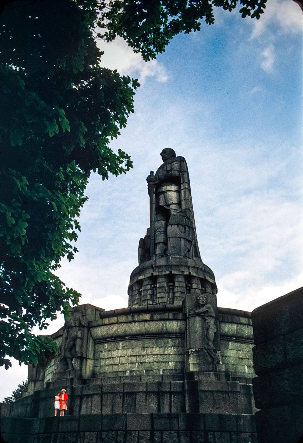 Two little girls add a splash of color to this shot of what seems to be the Bismarck monument in Hamburg.