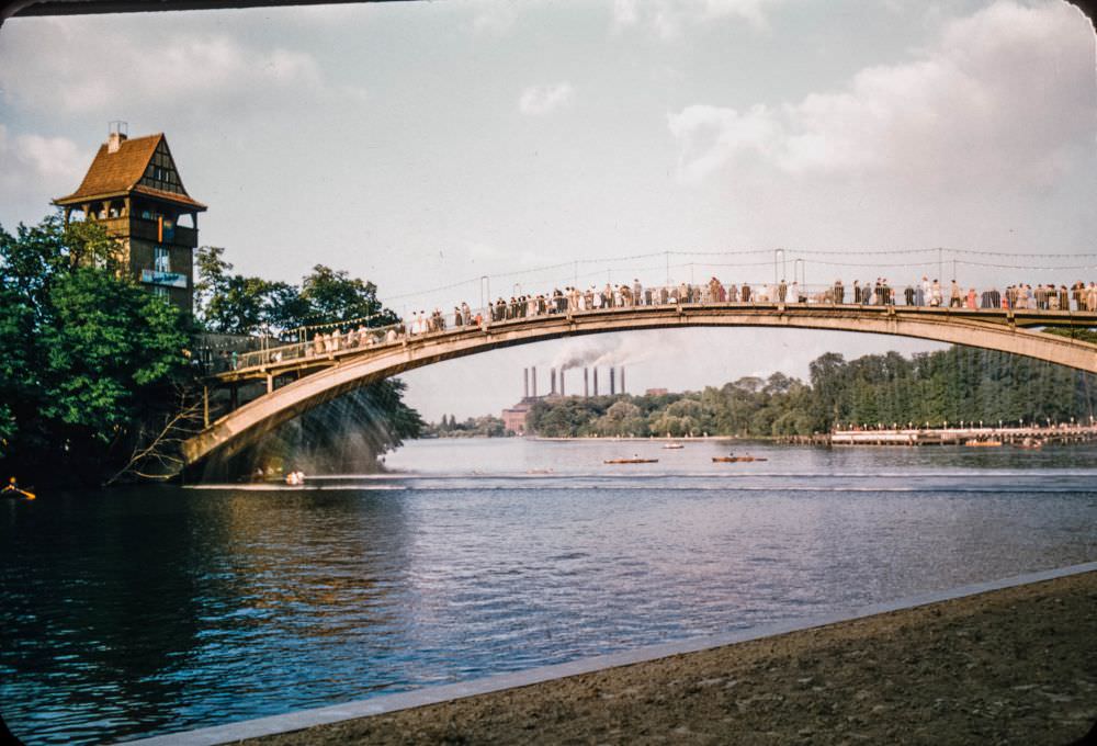 The 'Abteibrücke' bridge, leading to the 'Insel der Jugend' (island of youth) in Treptower Park. The factory in the background is the Kraftwerk Klingenberg.