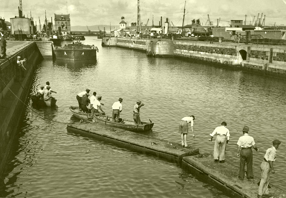 Fishing in the Robinson dry dock, 1949.