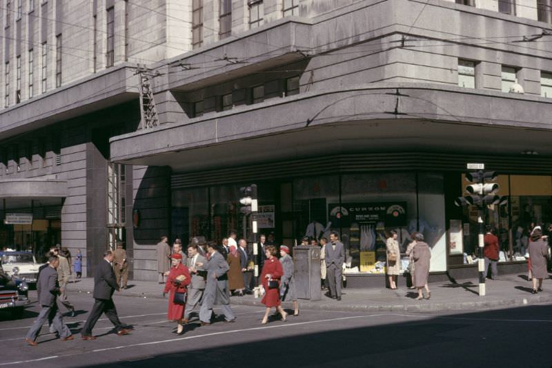 Pedestrians crossing street, 1960s