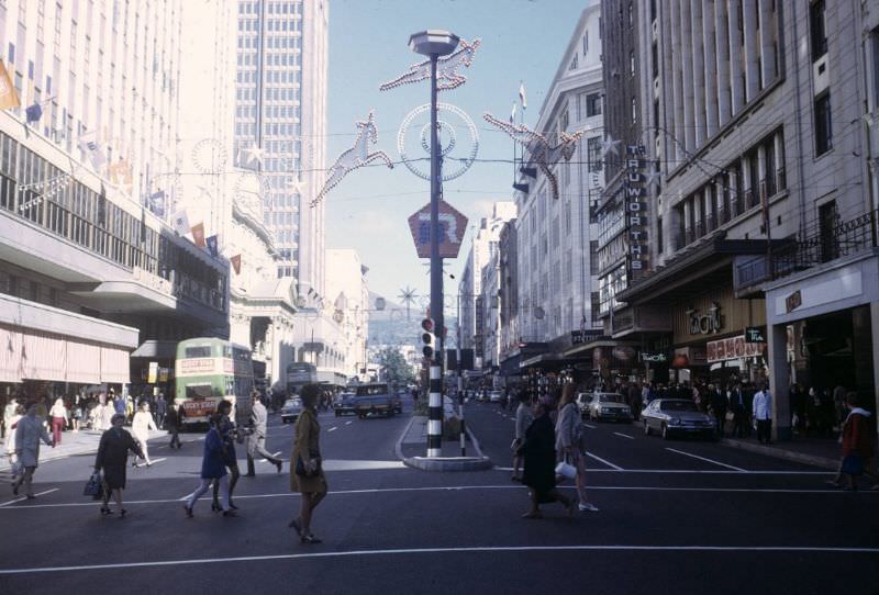 Pedestrians crossing street, 1960s