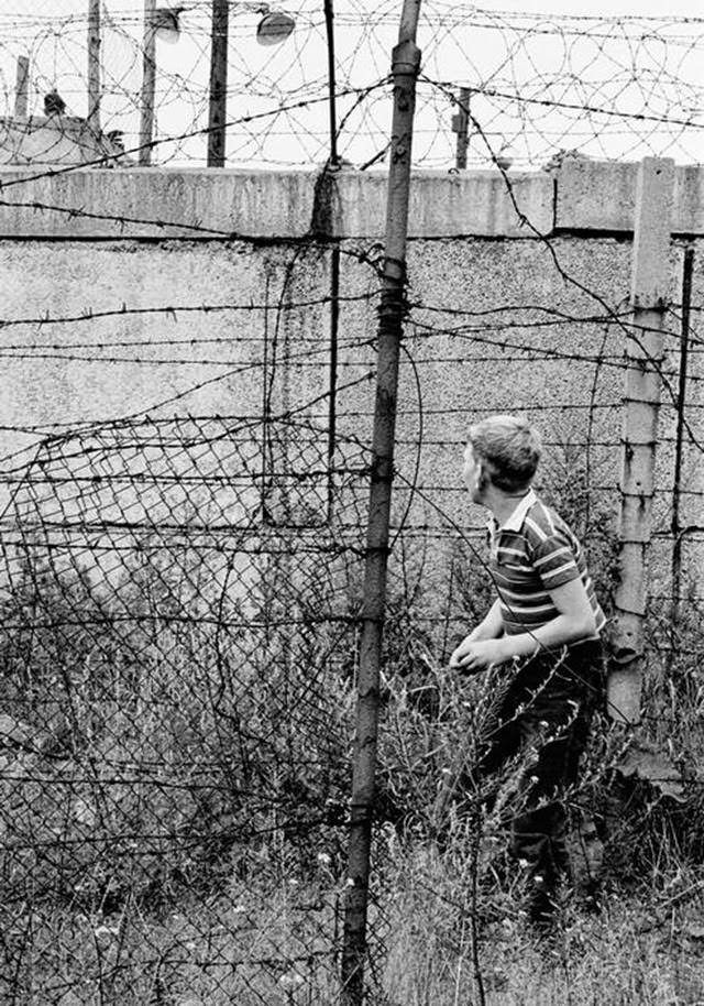 Children playing on the western side of the Berlin Wall.