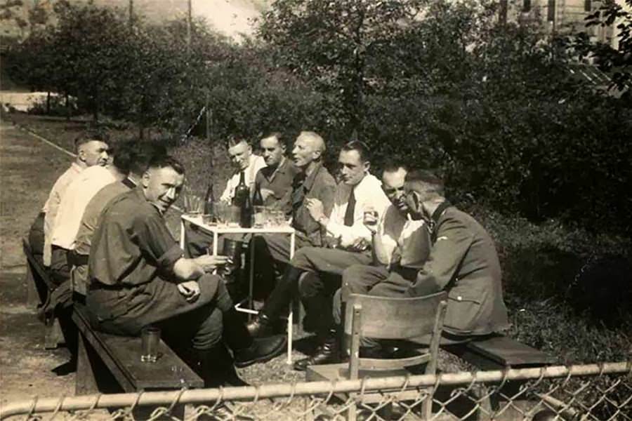 Finding comfort at Auschwitz: SS officers drink together.