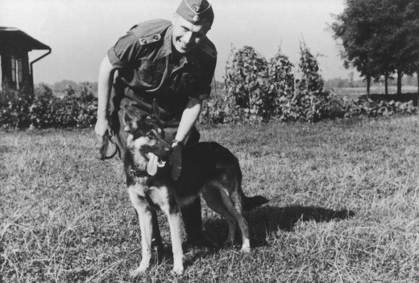 SS officer Karl Höcker pets his dog “Favorit.”