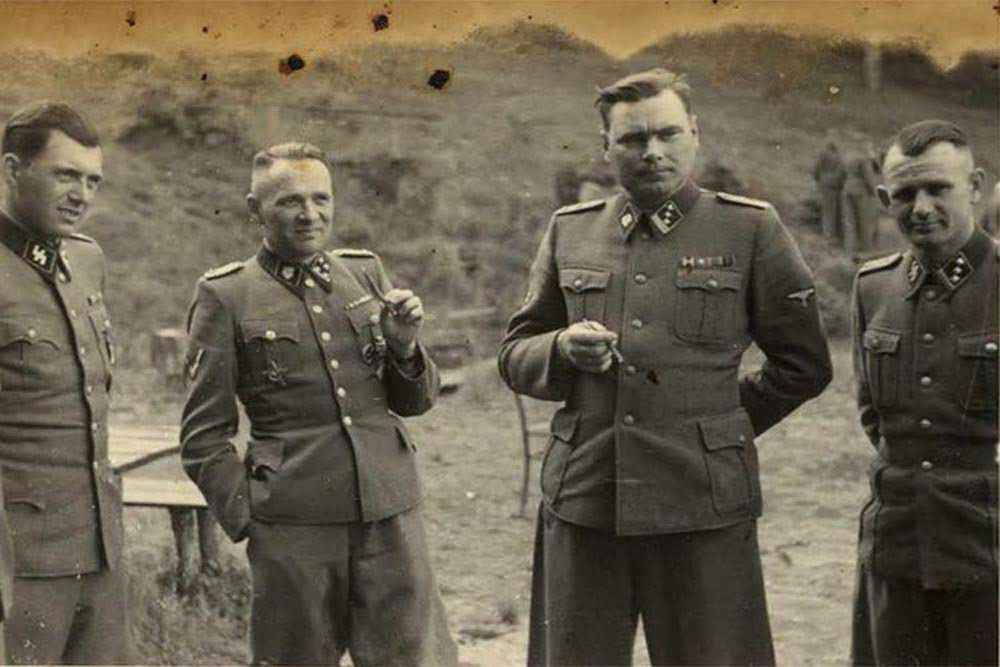 SS officers relax on the grounds of the Solahütte retreat.