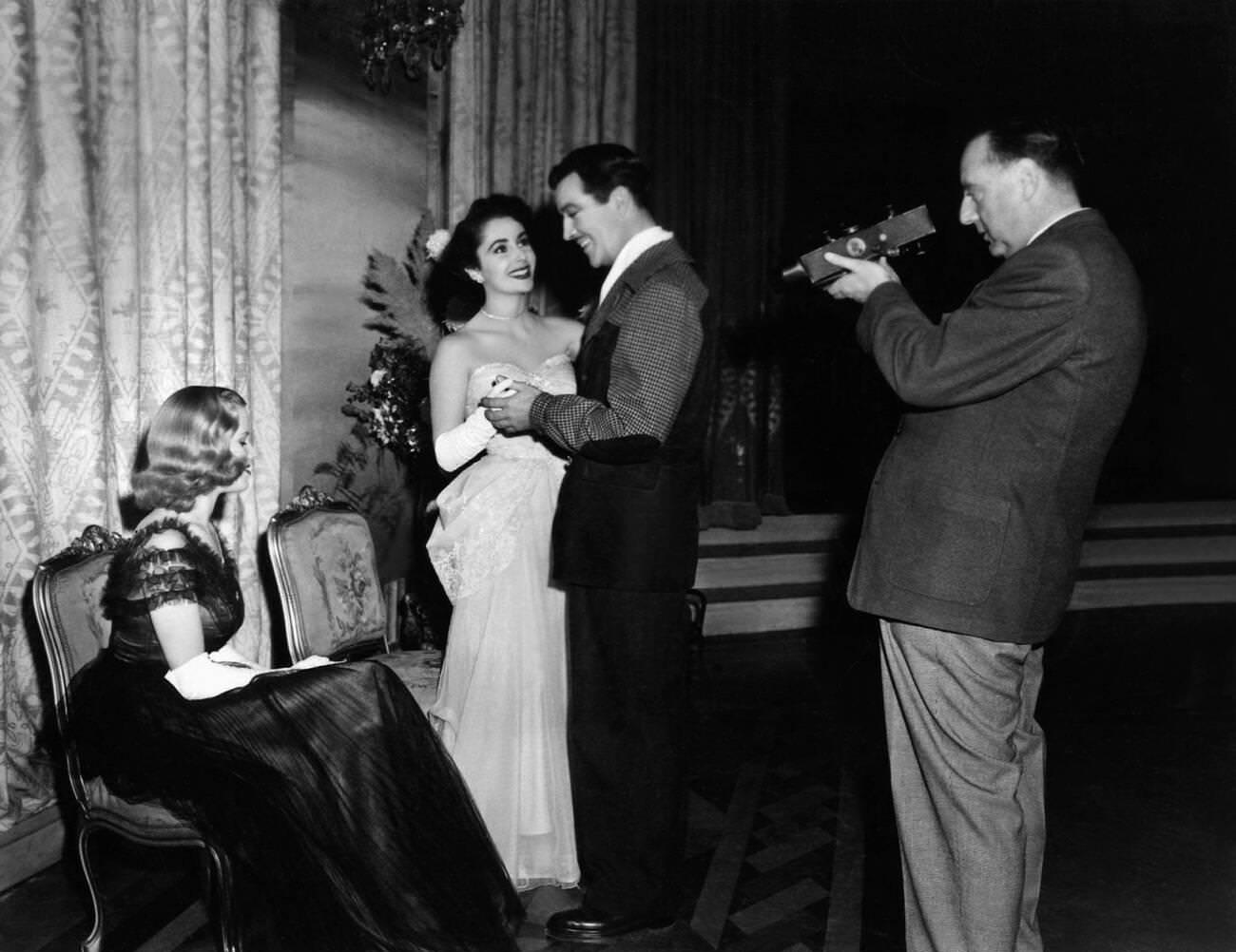 Honor Blackman, Elizabeth Taylor, and Robert Taylor in Conspirator, 1949.