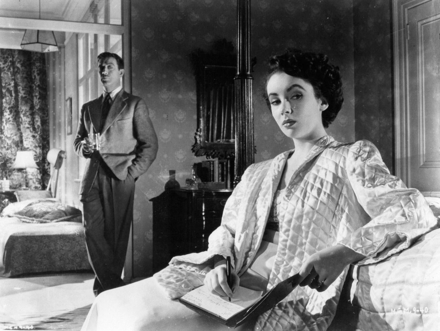 Robert Taylor watches Elizabeth Taylor in a scene from the film 'Conspirator', 1949.