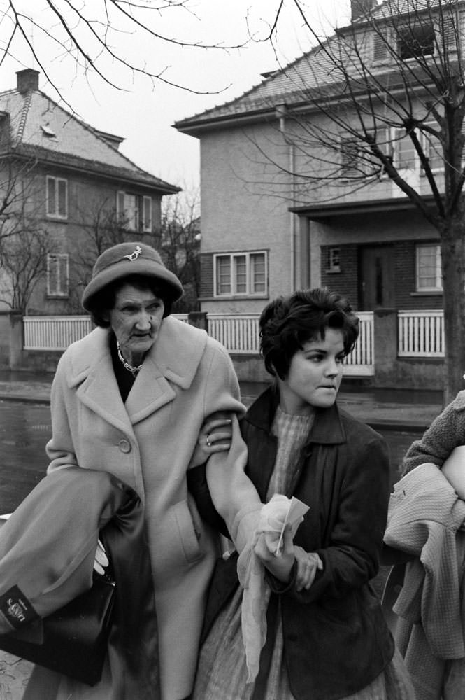 Elvis Presley's grandmother and Priscilla Beaulieu leave the house that Elvis and his family occupied in Bad Nauheim, Germany, March 1960.