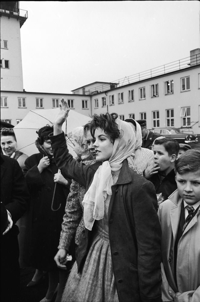 Priscilla Beaulieu waves to Elvis as plane takes off from Germany for U.S, March 1960.