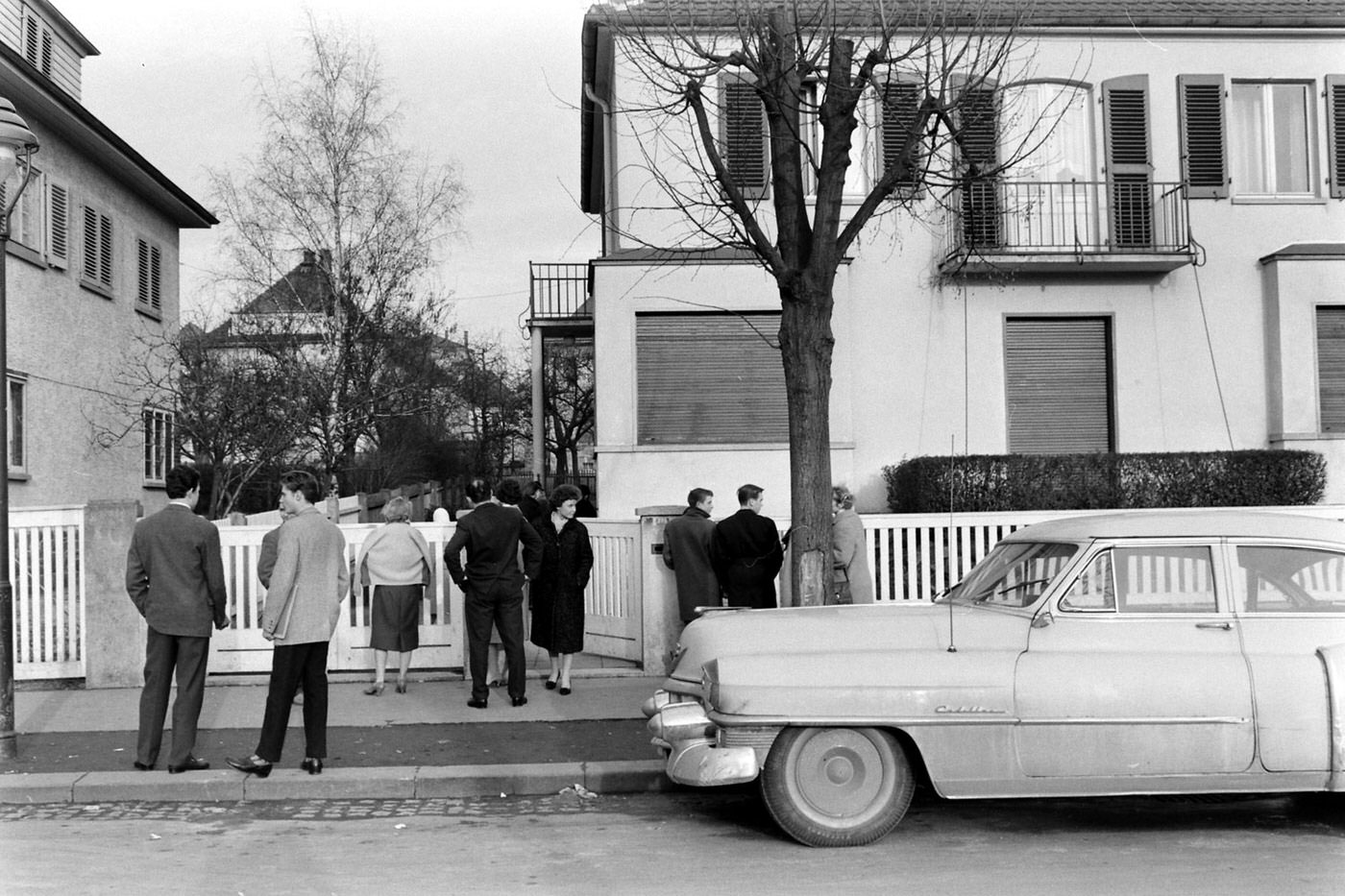 Elvis Presley fans congregate at the house in which Elvis and his family lived, shortly after he left the house for the last time, Bad Nauheim, Germany, March 1960.