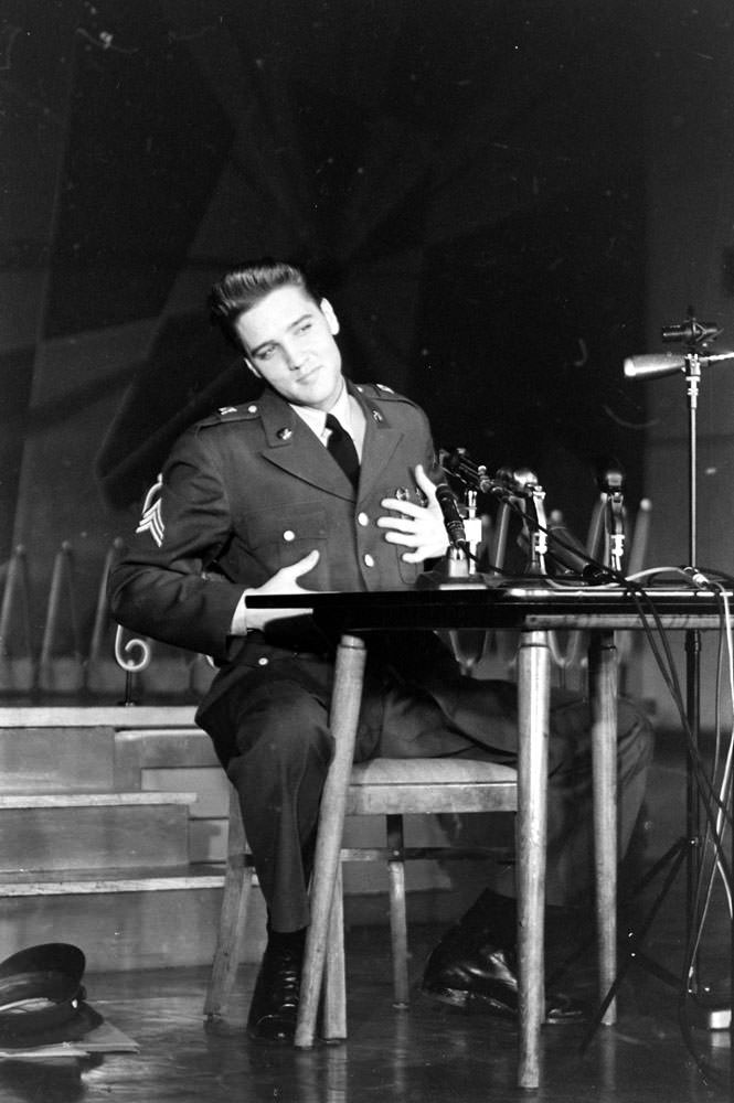 Sgt. Elvis Presley at a press conference before leaving Germany, March 1960.