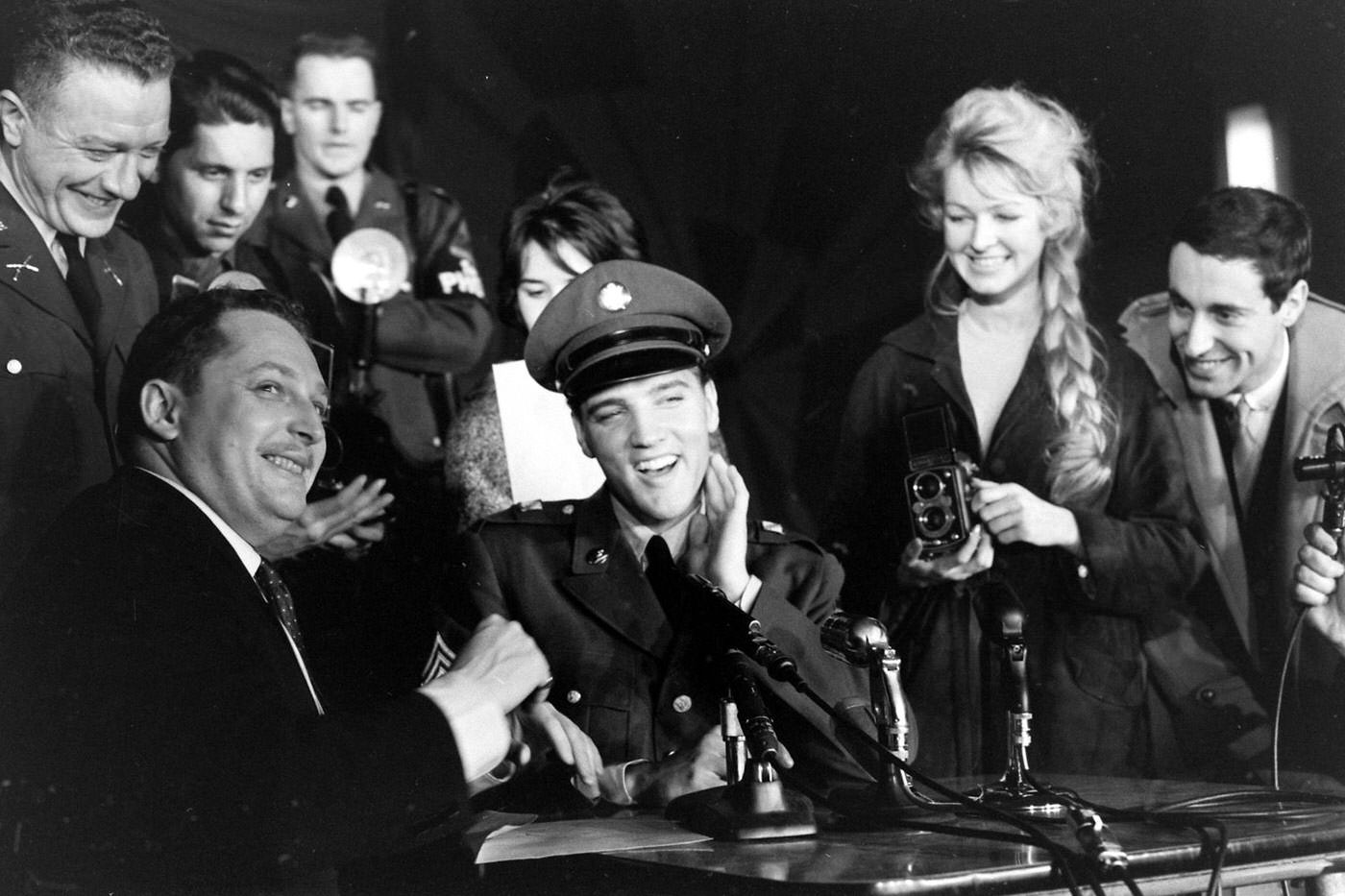 Sgt. Elvis Presley at a press conference before leaving Germany, March 1960.