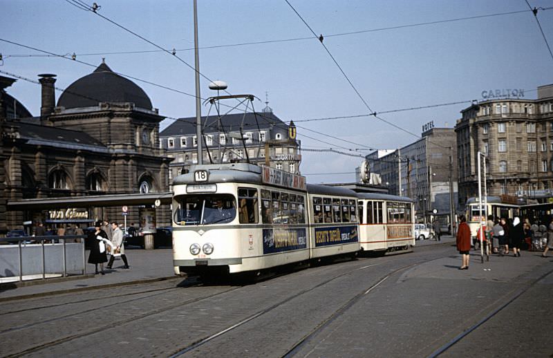 Frankfurt M series articulated tram 608 (Düwag/1959) with what appears to be a K series trailer (Uerdingen/1945-47) on Route 18 outside Frankfurt Hauptbahnhof, March 30, 1967