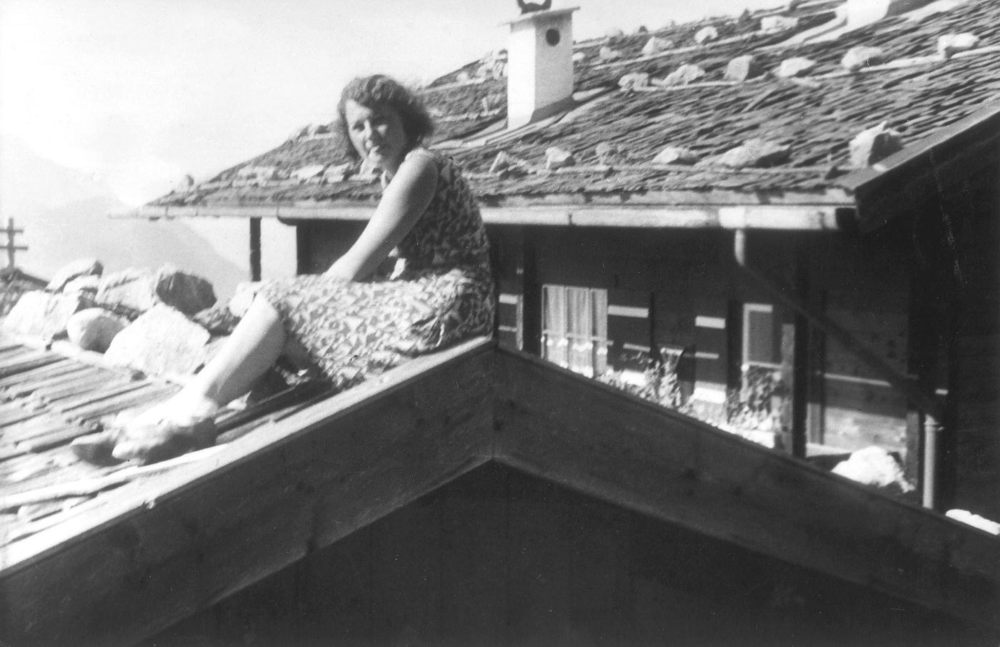 Geli Raubal on a shingle roof at Hitler's Obersalzberg estate (1930), a portrait of Adolf Hitler's niece.