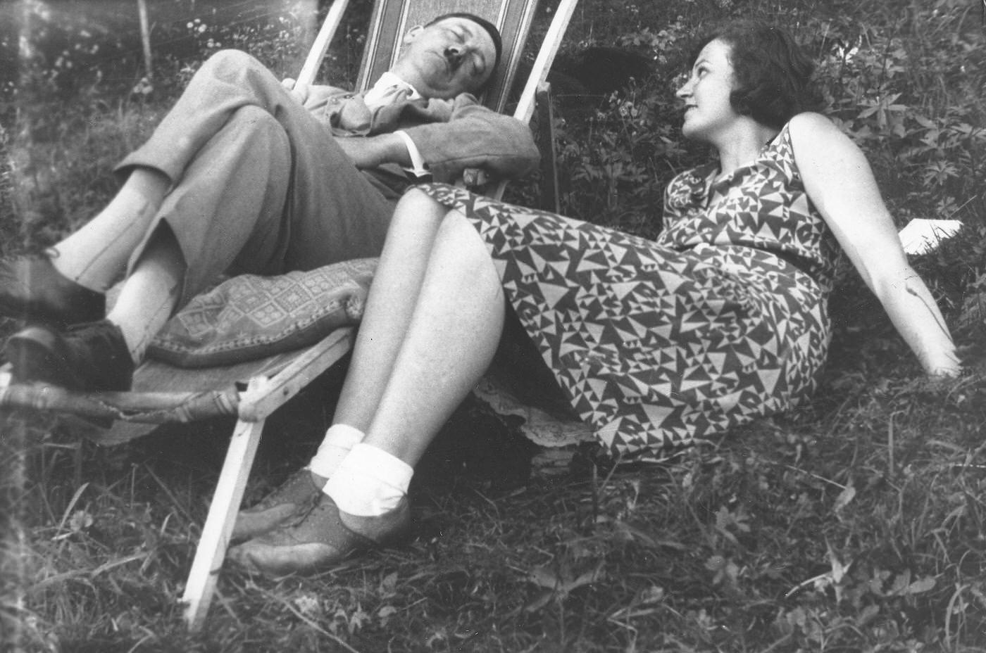 Adolf Hitler (left) sitting next to his niece Angela (Geli) Raubal in a deck chair, 1930