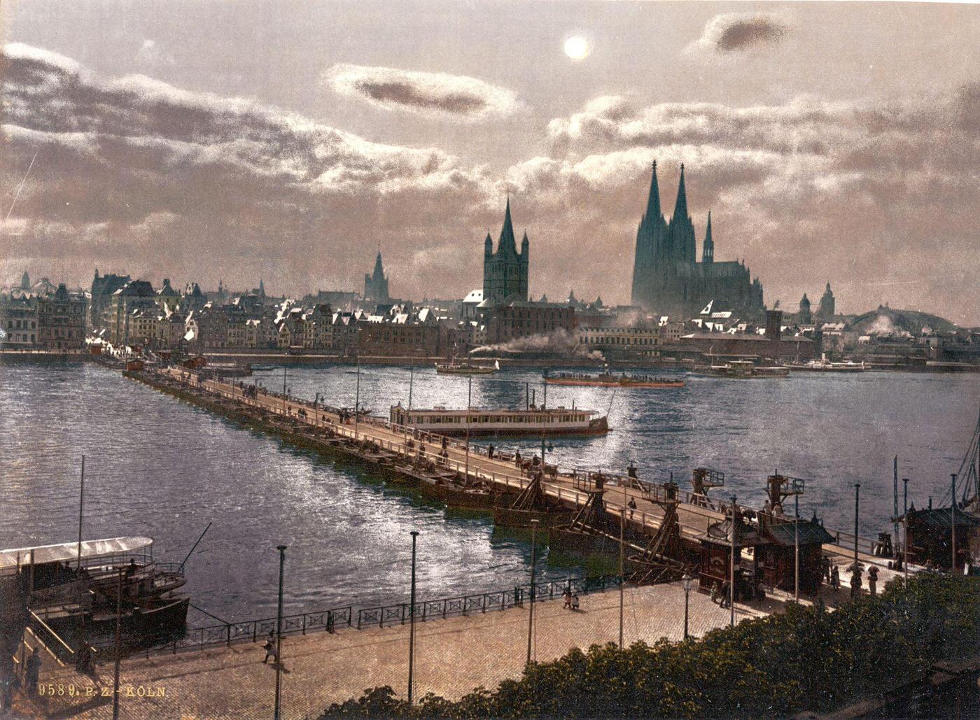 Moonlight across the river Rhine with the Cologne Cathedral, Cologne, Germany.
