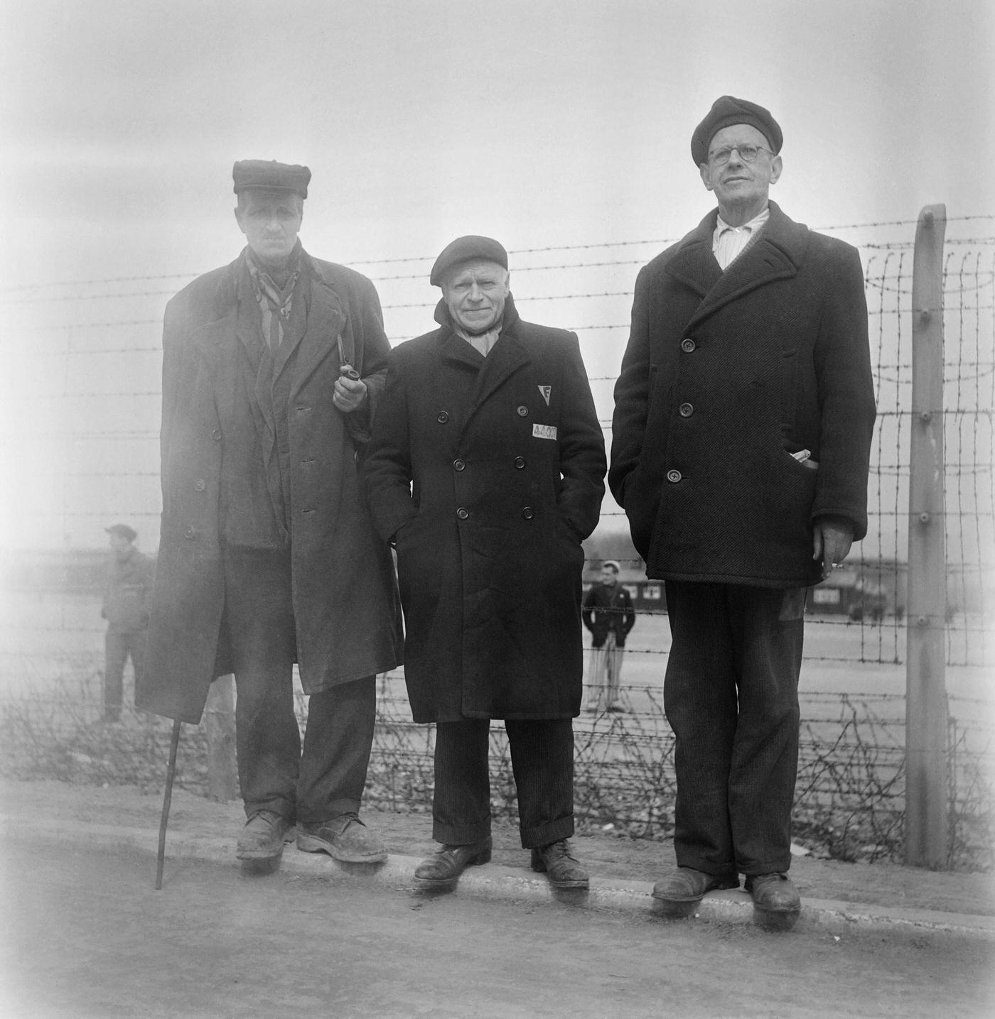 Picture taken in April 1945 at Buchenwald concentration camp featuring former French prisoners Maurice Hewitt, Charles Sander, and Tex.