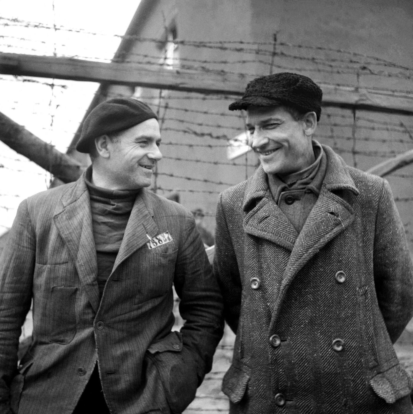 French prisoners Camille Sautereau and commander Bellon joke together in the courtyard of Buchenwald camp after its liberation in April 1945.