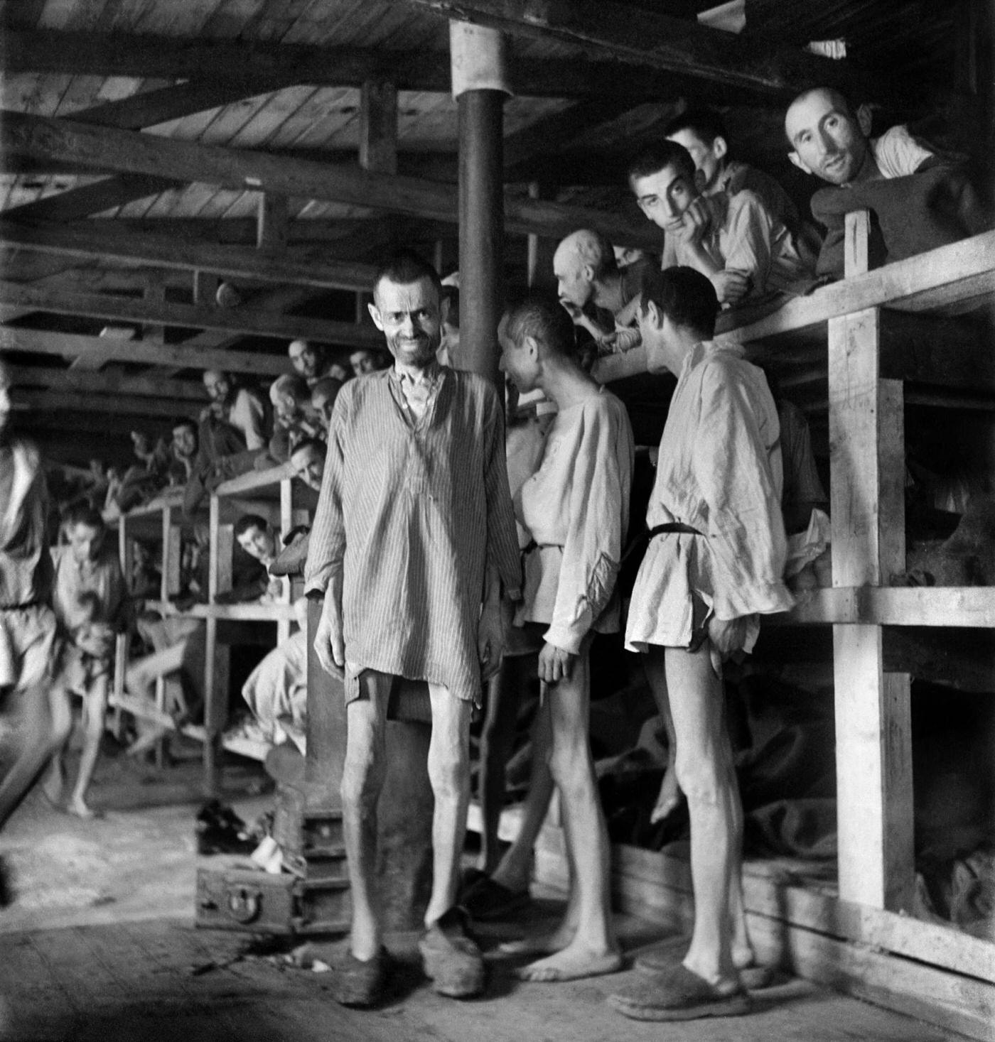 Prisoners dressed in wooden shirts and clogs given upon arrival at Buchenwald concentration camp, April 1945.