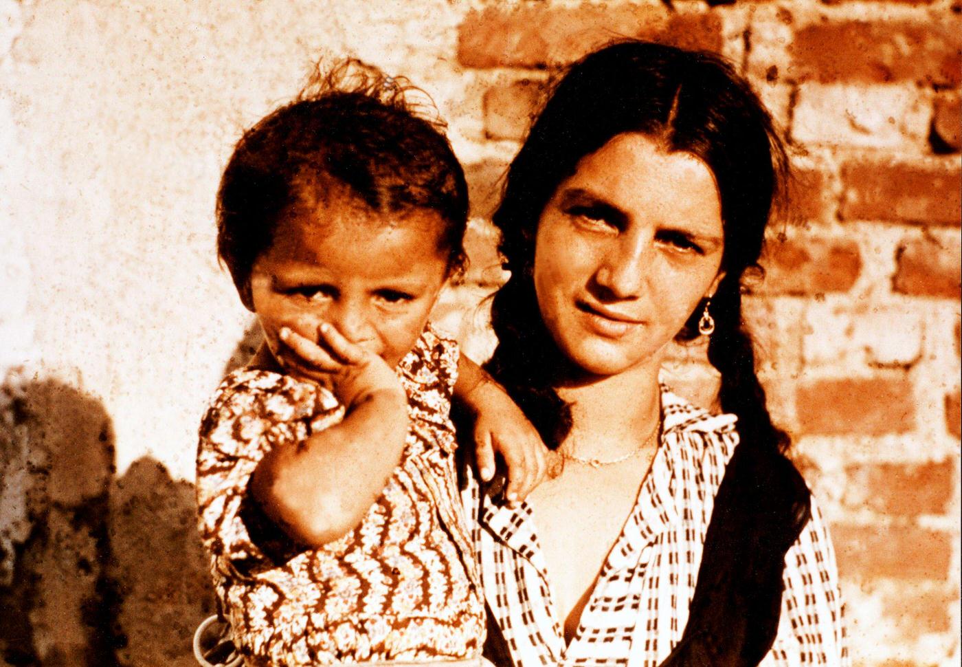 Gypsy (Sinti and Roma) deportation, a young woman with a child in a camp during an investigation conducted by the Racial Hygiene Research Center in 1938.