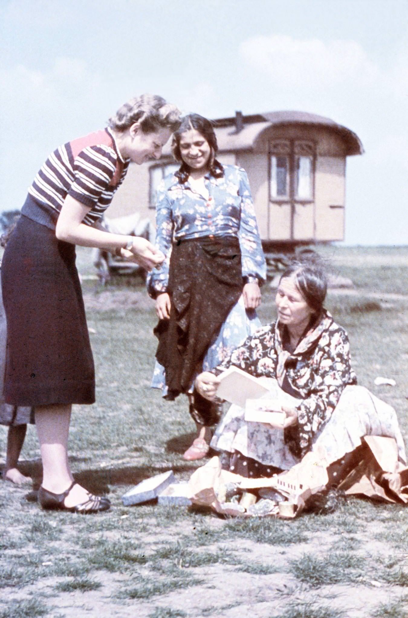 Sophie Ehrhardt of the Racial Hygiene Research Center conducting an interview with an old woman during the Gypsy (Sinti and Roma) deportation in 1938.