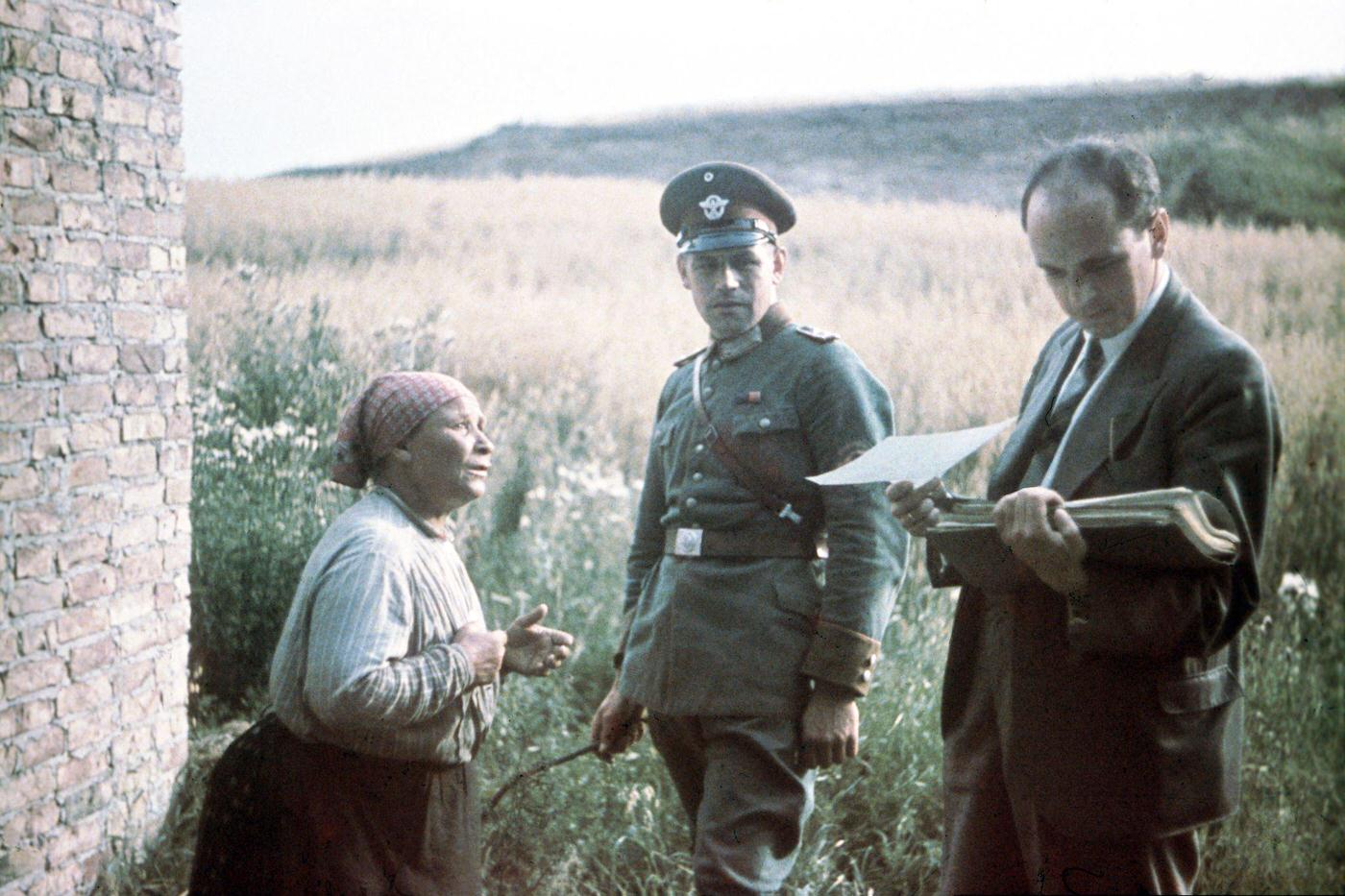 Dr. Robert Ritter, head of the Racial Hygiene Research Center, conducting an interview with an old woman during the Gypsy (Sinti and Roma) deportation in 1938.