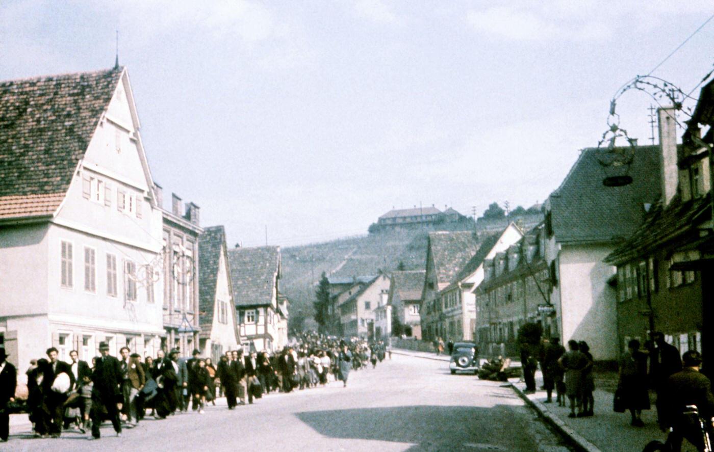 Sinti under police surveillance marching in Asperg before being locked up at Hohenasperg prison prior to deportation to camps in Poland, May 22, 1940.