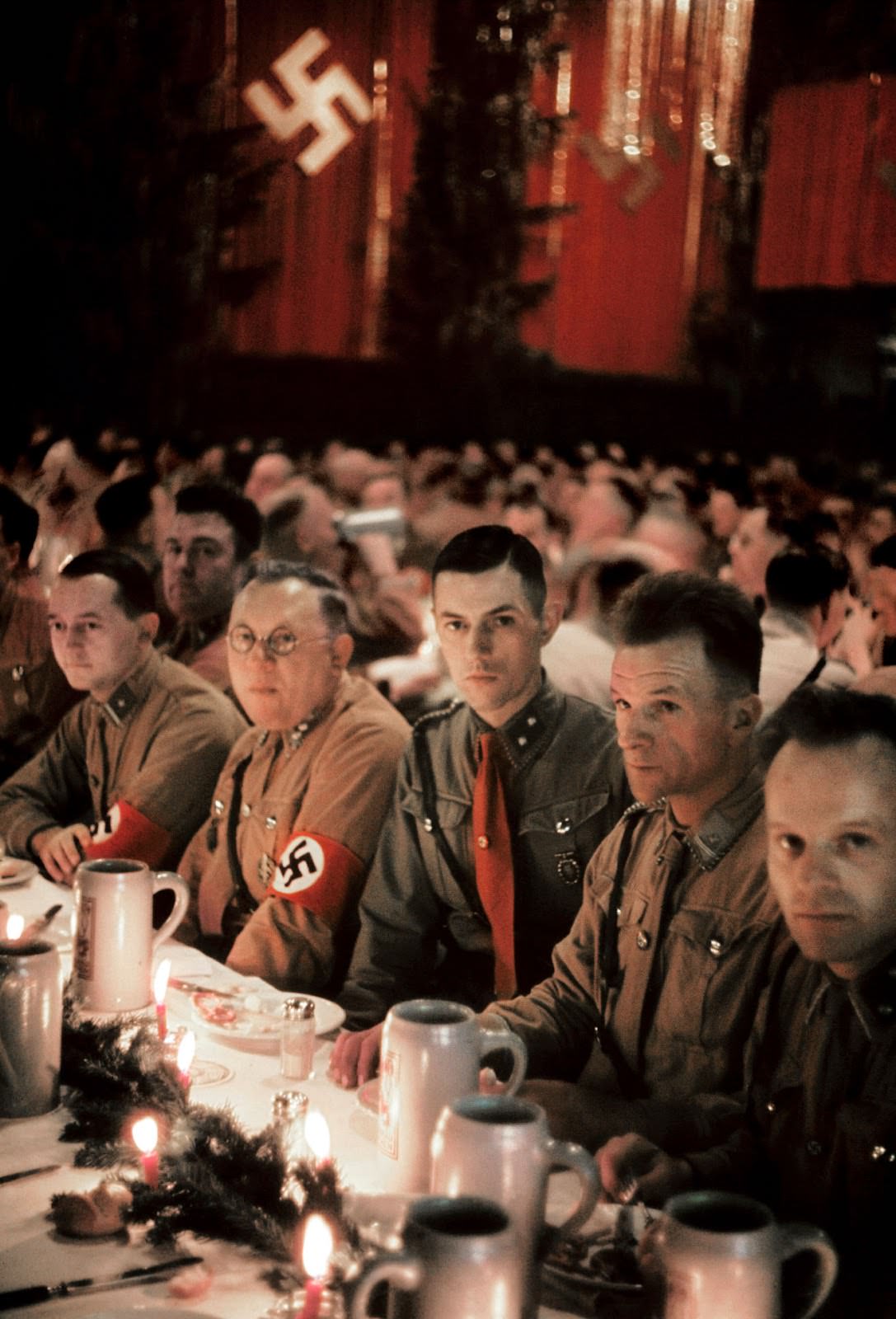 Group of underlings have a similarly stiff attitude at the Christmas party held on December 18, 1941 at a Munich beer house.