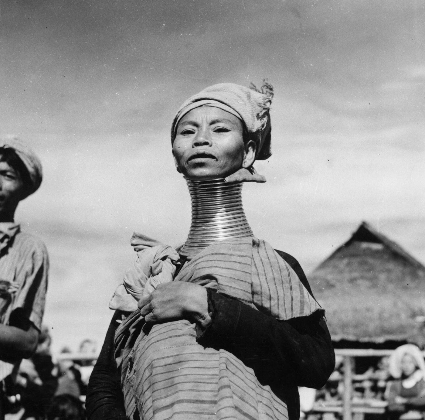 A Padaung, or Kayan woman, known for the brass rings fitted to their necks and limbs, Burma, 1950.