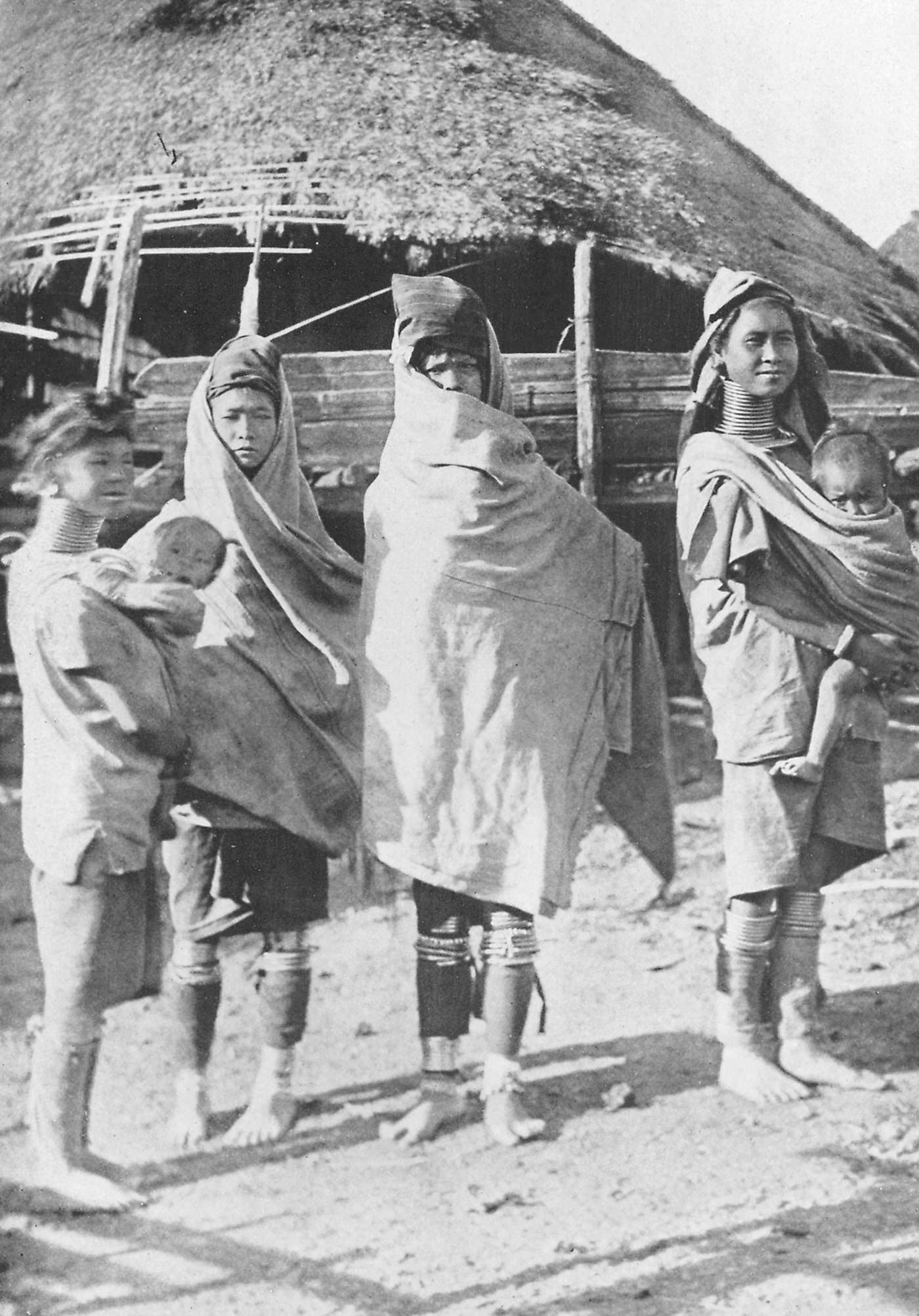 Padaung tribe members modeling cold weather clothing, Myanmar, 1922.