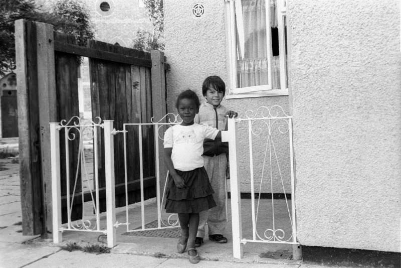 Two kids smiling, 1980s